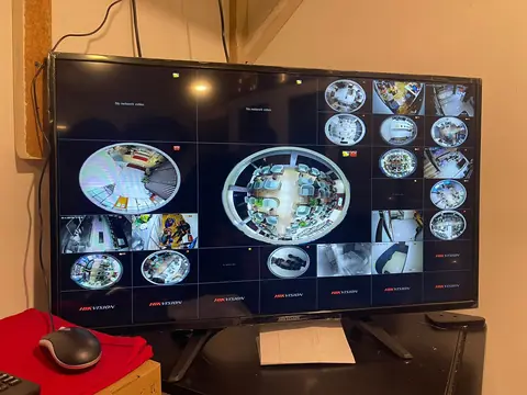 CCTV monitoring screen showing multiple camera feeds