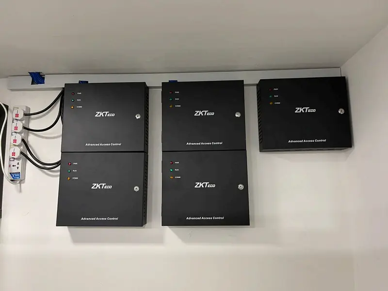 Four ZKTeco access control panels mounted on a wall